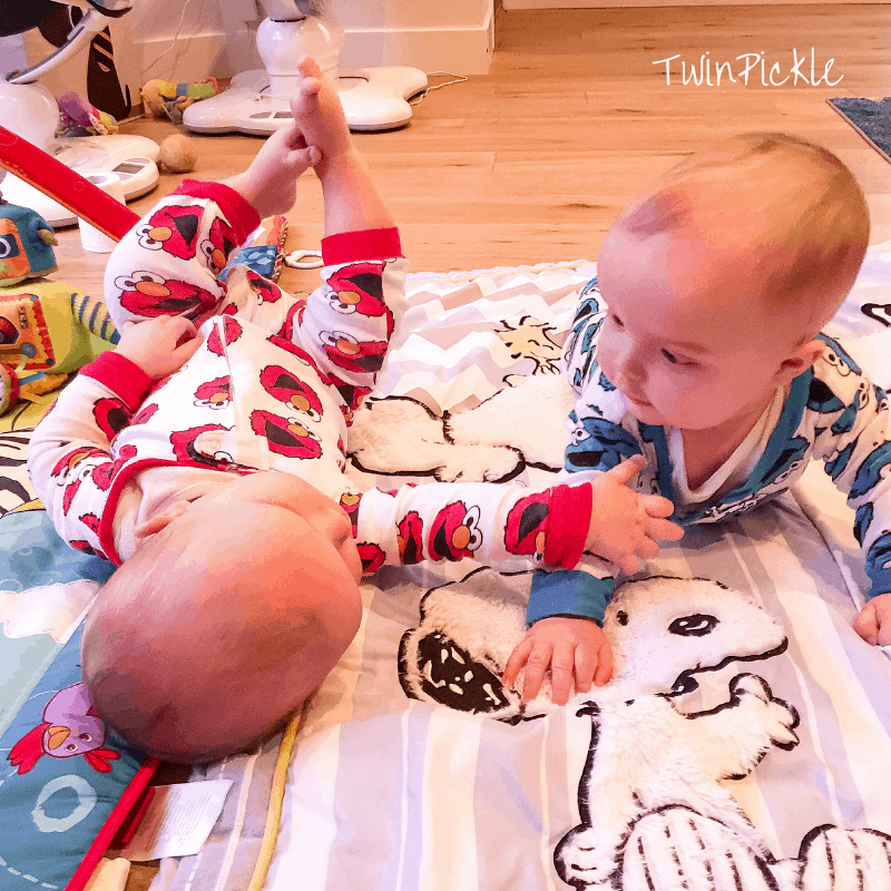 Twin babies playing infant formula