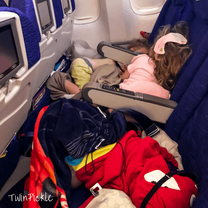 Three-kids-sleeping-on-the-plane