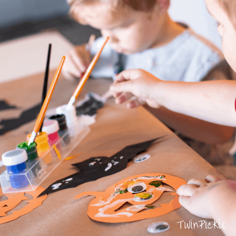 Child painting for Halloween crafts