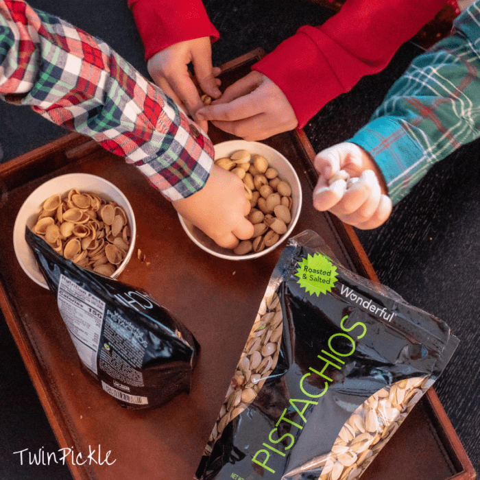 Pistachios kids snacking from bowl